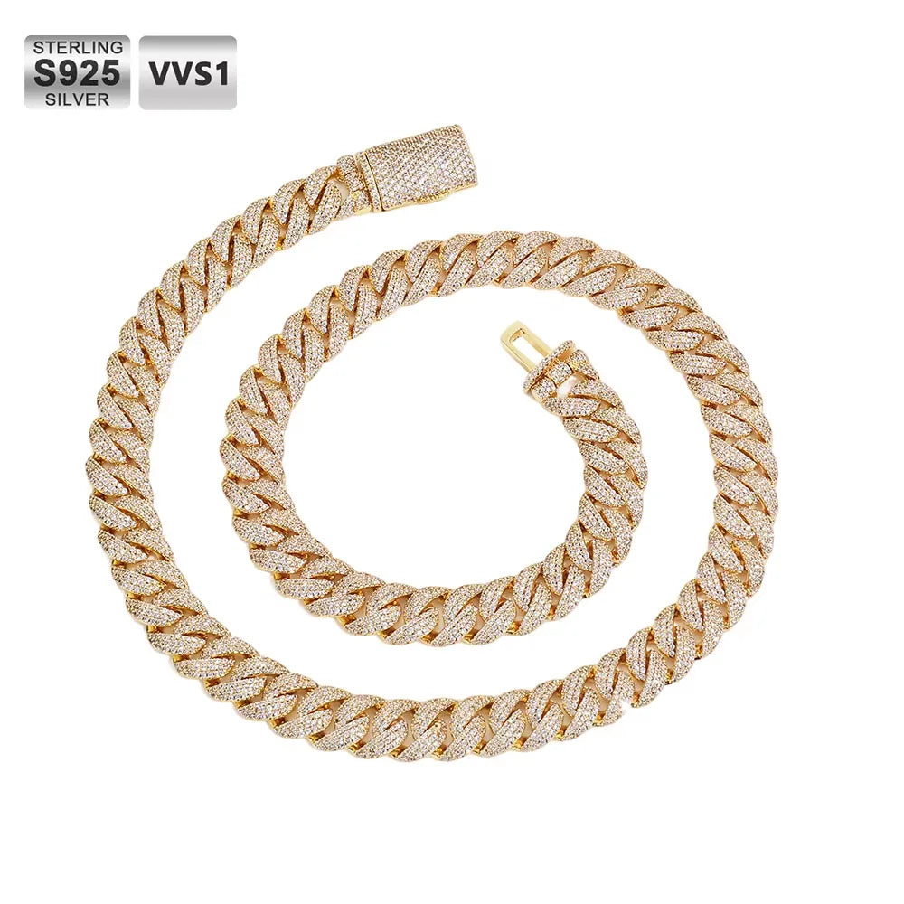 A gold-toned Cuban link chain necklace paved with clear rhinestones, arranged in a spiral on a white background. Text overlays in the top-left corner read 'STERLING S925 SILVER' and 'VVS1'.