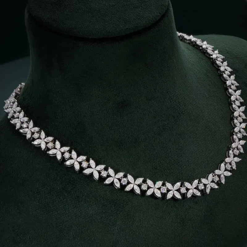 Diamond necklace on a dark green mannequin