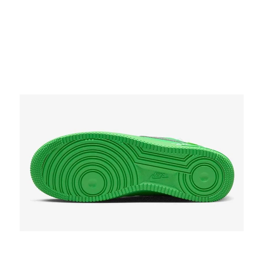 Green sole of a sneaker on a white background