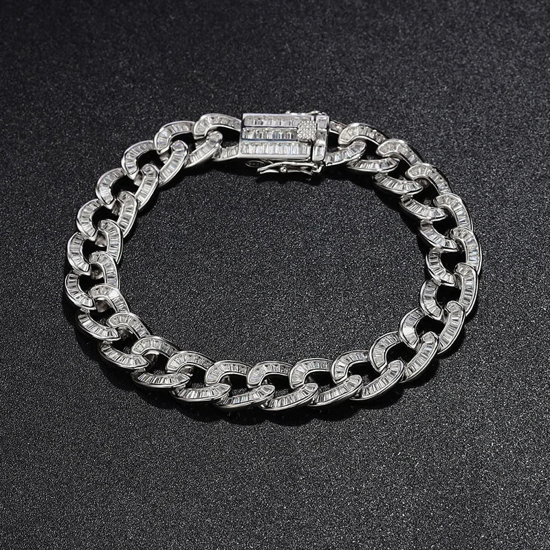 Silver chain bracelet on a black background