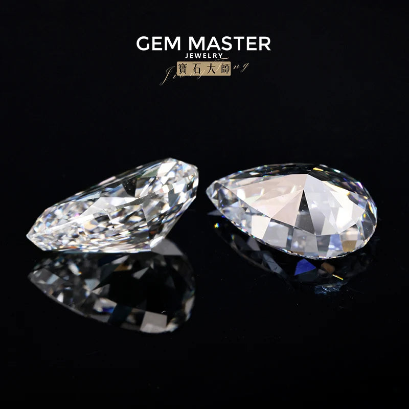 Two clear gemstones on a black background with 'Gem Master Jewelry' branding.