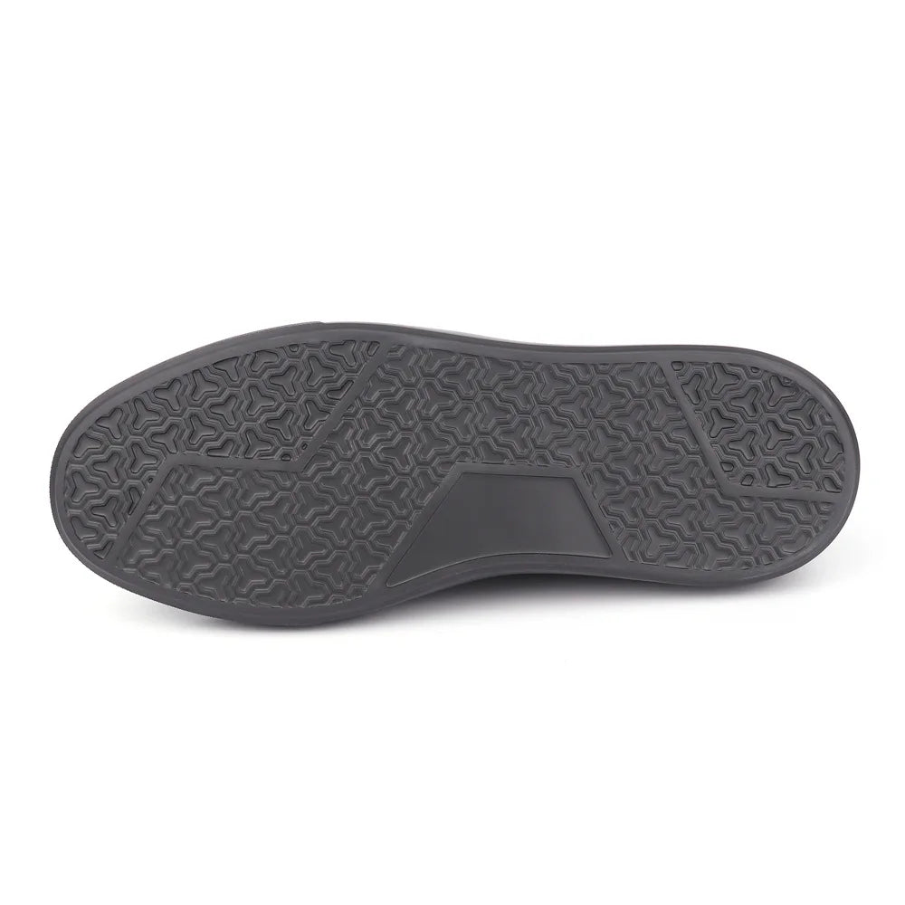 The black textured rubber outsole of a shoe, shown from a top-down view against a plain white background.