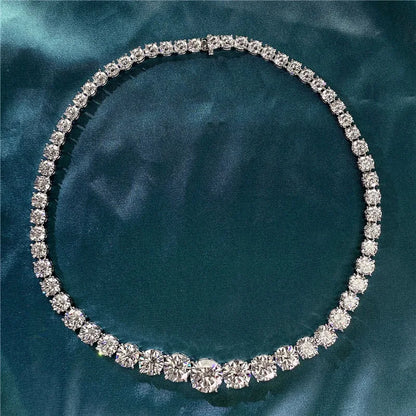 Diamond necklace on a teal fabric background