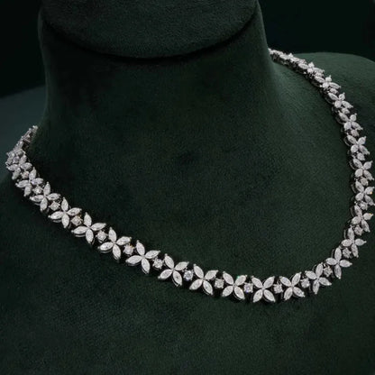 Diamond necklace on a dark green mannequin