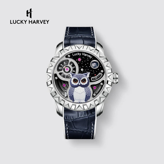 Lucky Harvey wristwatch with a silver-tone case, textured bezel, dark blue alligator leather strap, and a skeleton dial featuring a blue and white owl on a starry black background.