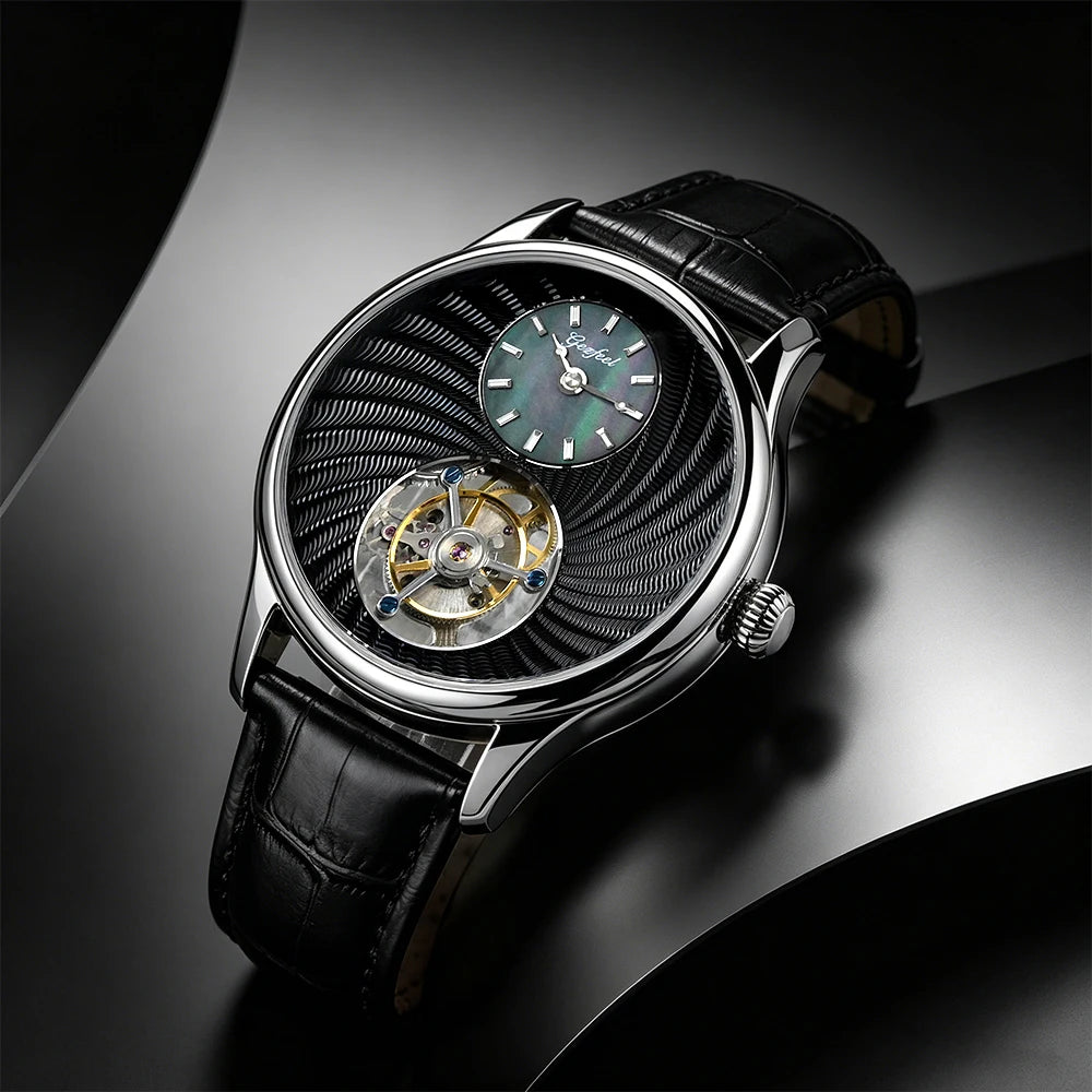 A luxury wristwatch with a black leather strap, a silver-toned case, and a distinctive black textured dial featuring a visible open-heart tourbillon and a green sub-dial.