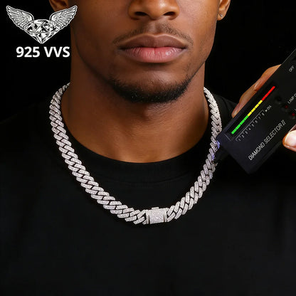 Man wearing a silver chain necklace with a diamond selector tool and 925 VVS logo.
