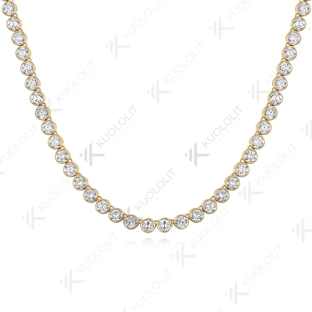 A yellow gold tennis necklace featuring round-cut clear gemstones in a classic bezel setting, displayed on a clean white background with a faint reflection.