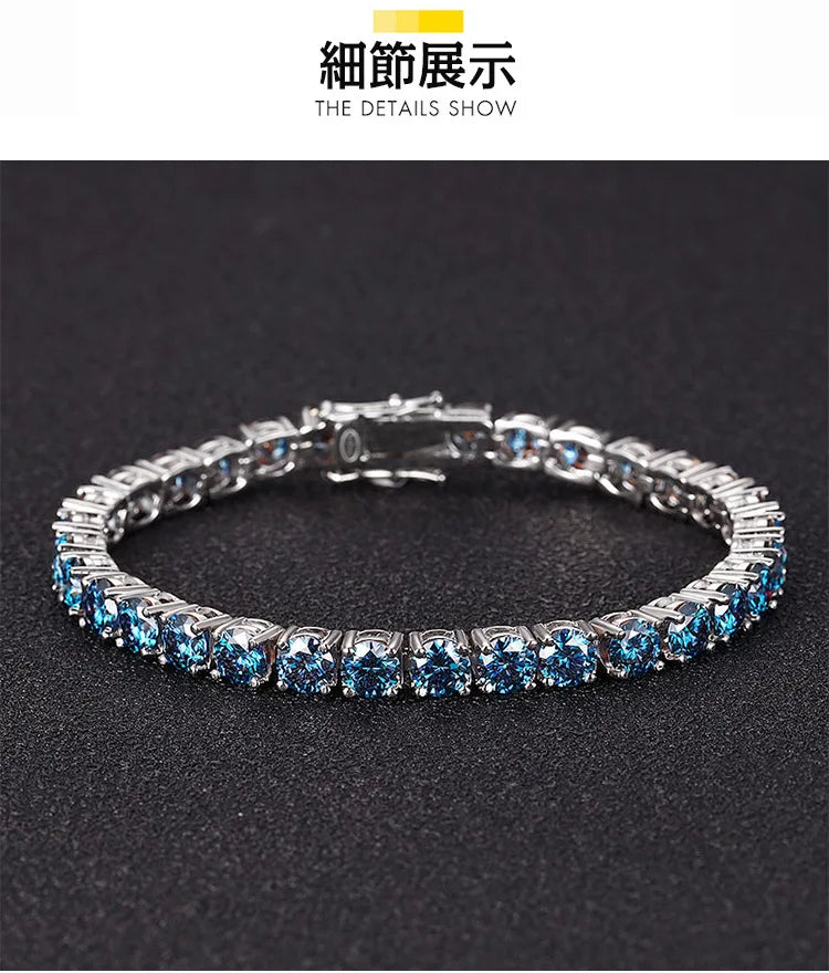 A silver tennis bracelet with round-cut light blue gemstones, displayed on a textured black background. The top of the image features a white banner with Chinese text '新通出版' and English text 'THE DETAILS SHOW'.