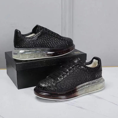Black textured sneakers on a white surface with a gray background