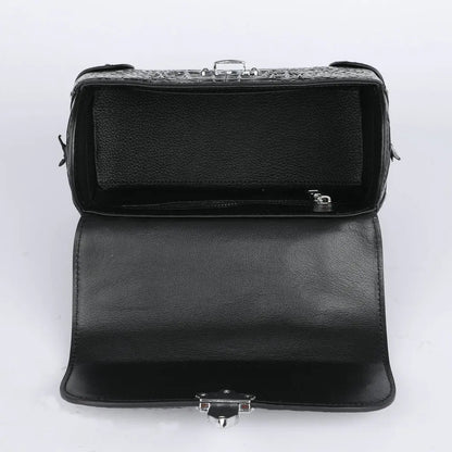 Black leather clutch handbag shown open, displaying its interior compartments, textured interior lining, and silver-tone metal clasp hardware on a white background.