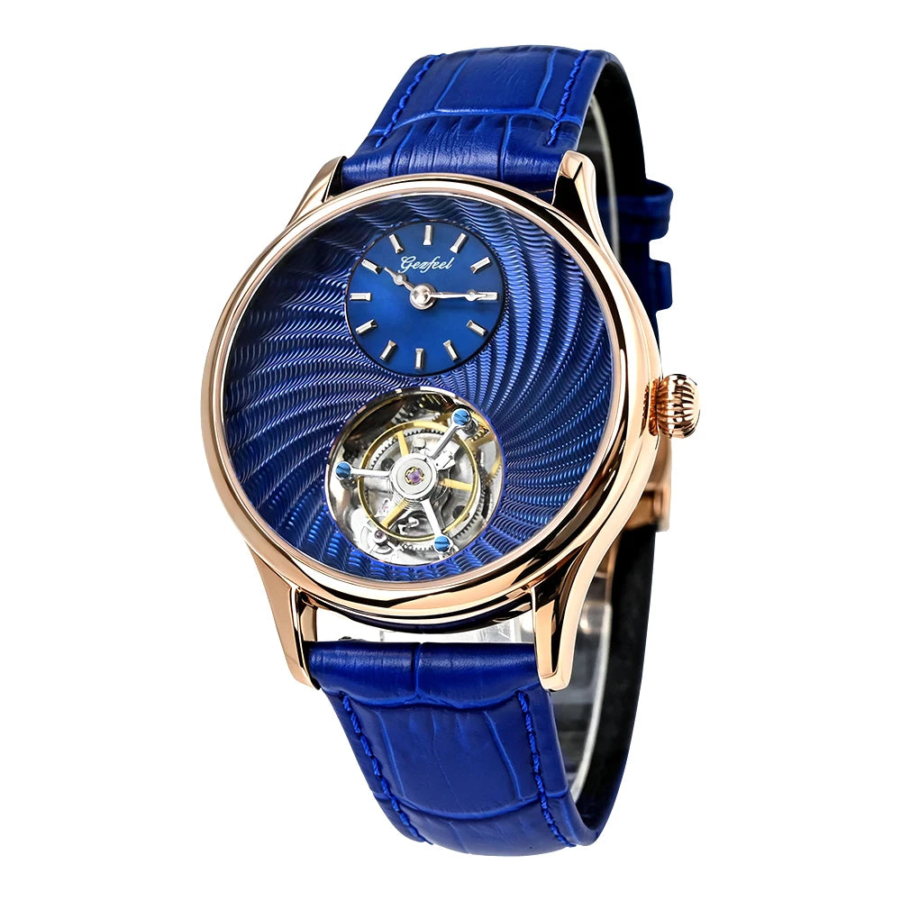 A luxury wrist watch featuring a vibrant blue textured dial, a visible mechanical movement through a cutout, and a matching blue leather strap with a rose gold case.