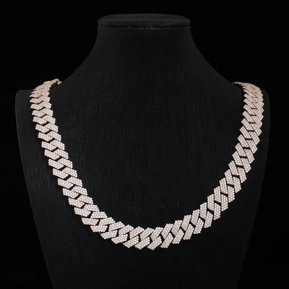 Gold chain necklace on a black mannequin bust