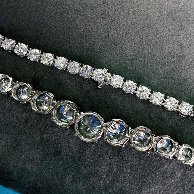 Silver bracelet with clear gemstones on a dark background