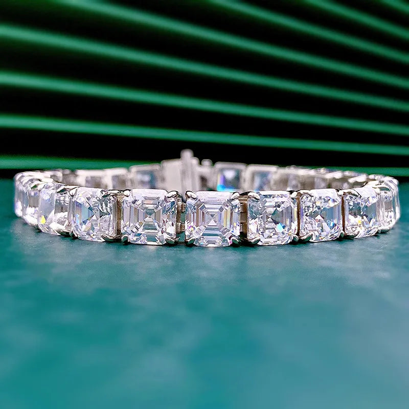 Diamond bracelet on a teal surface with a green background