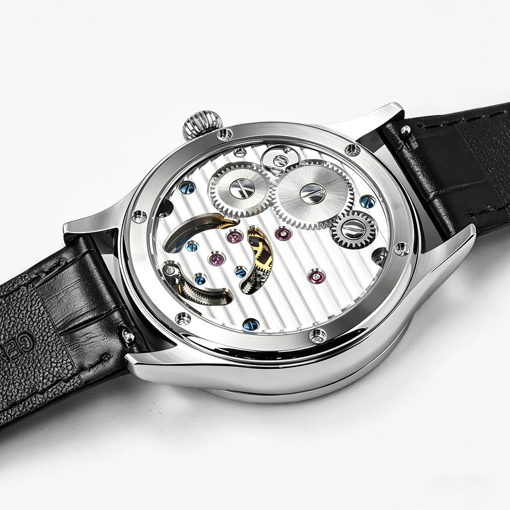 Luxury watch with black leather strap and visible mechanical components on a white background