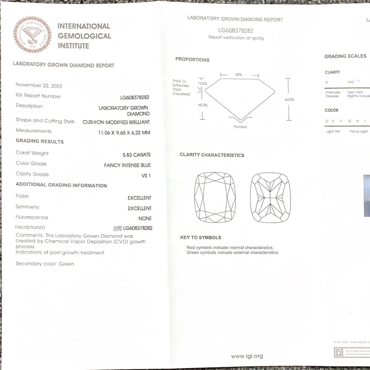 A folded laboratory gemstone report page from the International Gemological Institute, showing diamond grading information, proportions, clarity characteristics, and a key to symbols for a laboratory grown diamond.