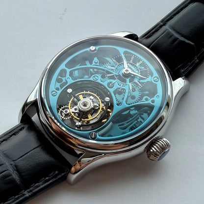 Luxury watch with black leather strap and transparent face on a light gray background