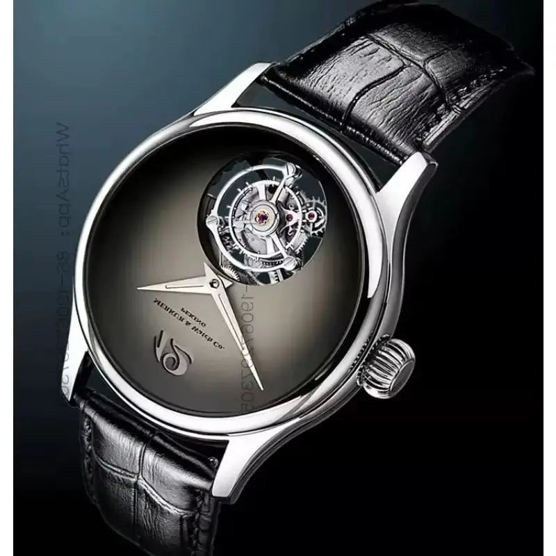 A luxury skeleton watch with a polished silver-tone case, black leather strap, and a dark gray dial showing the inner mechanical movement. The watch is photographed at an angle against a dark gradient background.