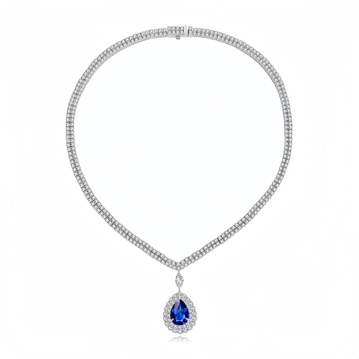 A silver-tone necklace featuring a textured chain paved with small clear stones, with a teardrop-shaped blue gemstone pendant surrounded by a halo of clear stones, shown on a white background.