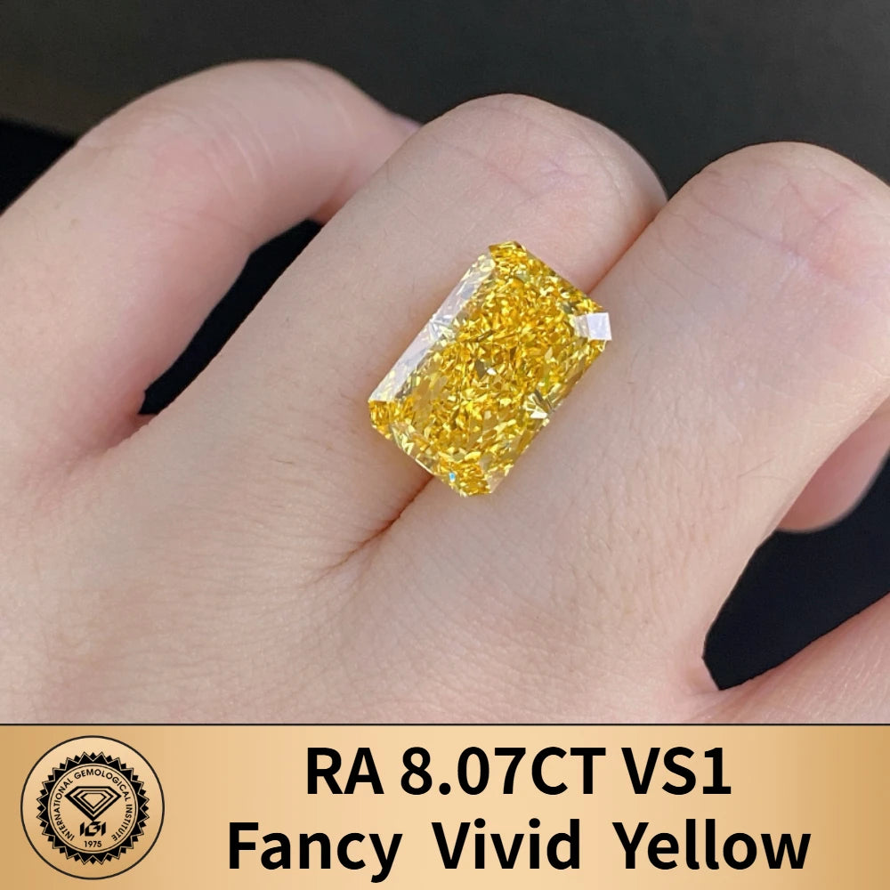 Gold ring with a yellow gemstone on a hand, featuring GIA certification.