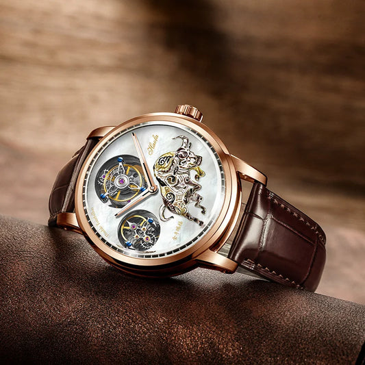 A luxury skeleton watch with a rose gold case, white mother-of-pearl dial, and brown leather strap, resting on a textured brown surface.