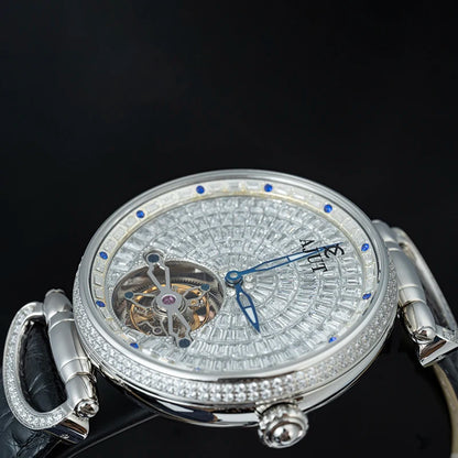 Luxury watch with intricate design and diamond accents on a black background