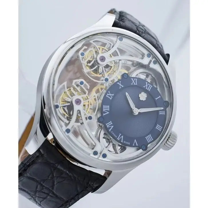 A luxury skeleton watch with a polished silver-tone case, a dark blue dial with Roman numerals, and a black alligator leather strap.