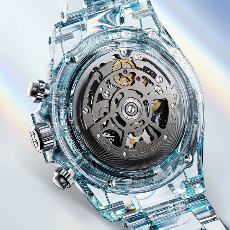 Close-up of a transparent light-blue resin watch with a visible mechanical movement through the open back case, shown on a clean white background with a soft rainbow sheen.