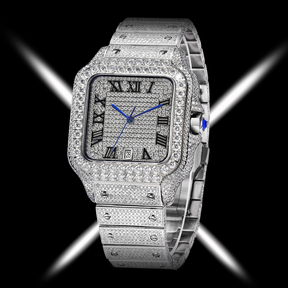 A luxury watch with a silver-toned rectangular case and integrated bracelet, heavily embellished with sparkling pavé stones. The watch face features black Roman numeral hour markers, silver hands, and a small blue cabochon accent on the crown, set against a black background with dramatic white light streaks.