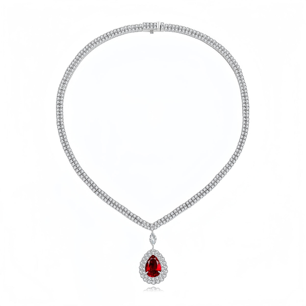 A silver-toned diamond necklace with a teardrop-shaped red gemstone pendant, displayed on a clean white background.