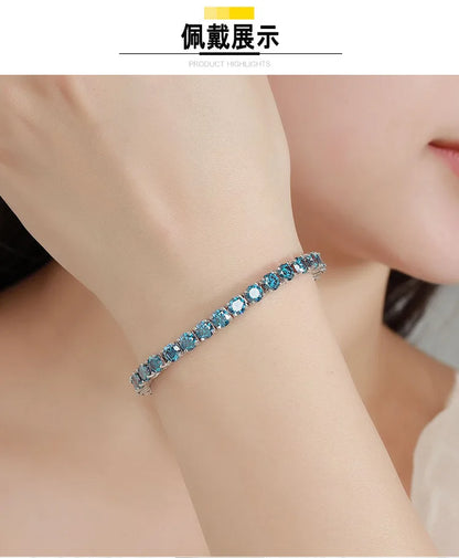 A close-up of a woman's wrist wearing a silver-toned bracelet adorned with a row of light blue faceted gemstones. The image includes a top banner with Chinese text '通袋变装' and 'PRODUCT HIGHLIGHTS'.
