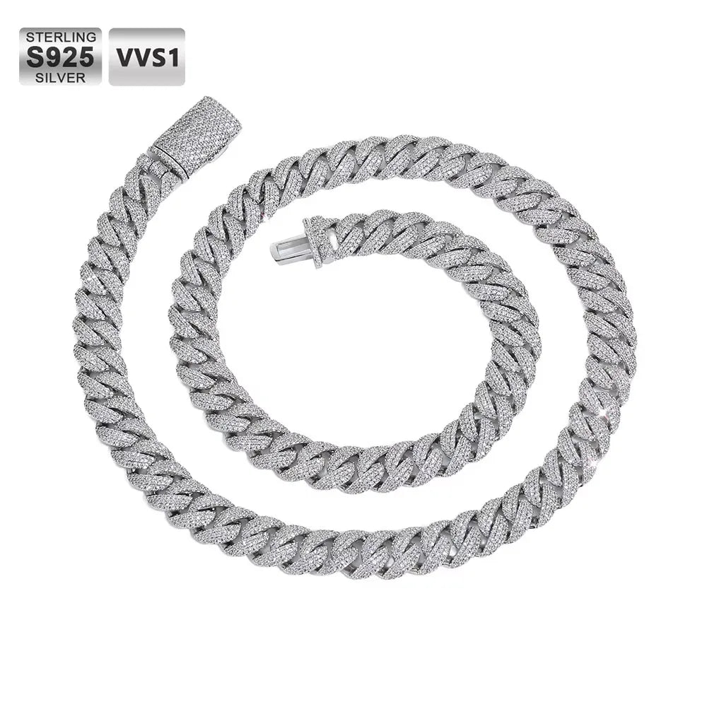 Sterling silver Cuban link chain necklace coiled on a white background, featuring a textured pavé-set appearance and a lobster clasp. Text overlays in the top-left corner read 'STERLING S925 SILVER' and 'VVS1'.