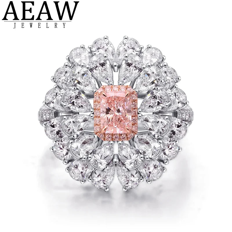 AEAW Jewelry ring featuring a central peach-colored cushion-cut diamond surrounded by a halo of clear round and marquise-cut diamonds in a silver-toned setting, shown on a white background.