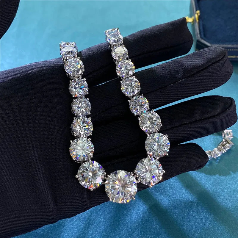 Diamond bracelet on a black glove with a blue background