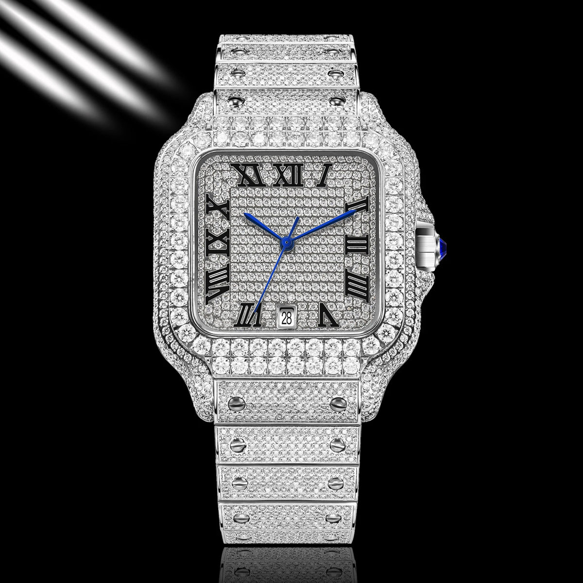 A luxury watch with a silver-toned square case and integrated bracelet, completely paved with sparkling clear stones. The dial is silver with black Roman numerals and vibrant blue hands, accented by a blue cabochon on the crown.