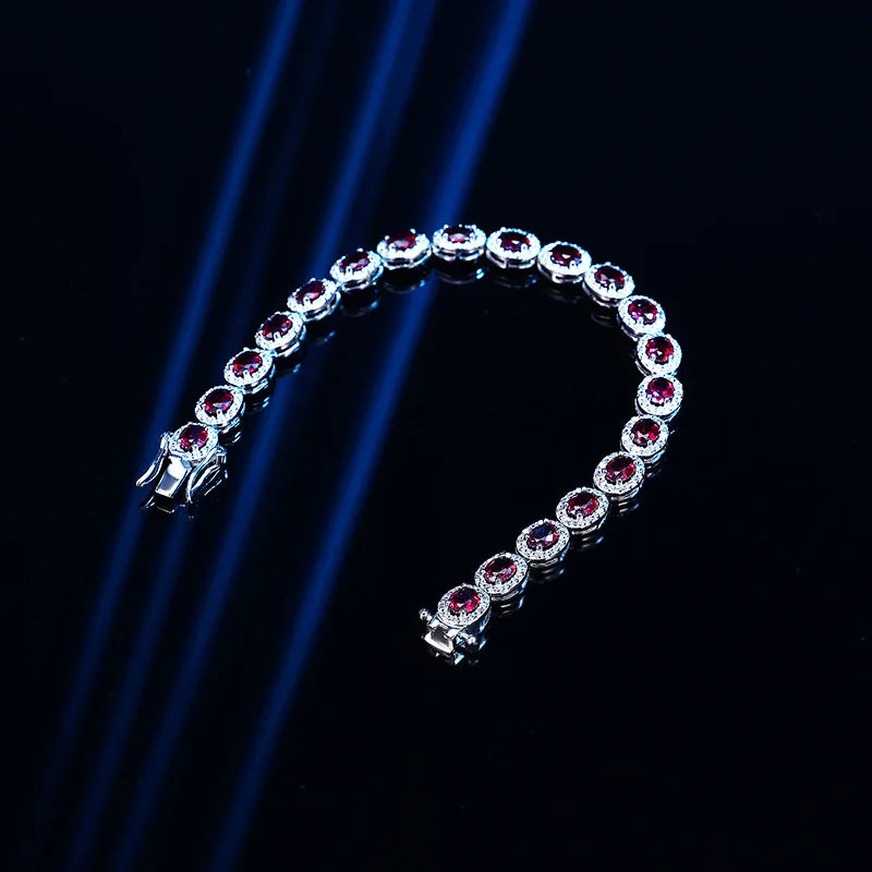 Bracelet with red gemstones on a black background